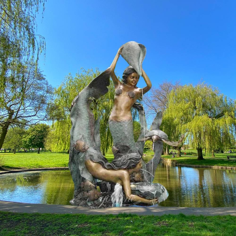 bronze mermaid with conch shell in hands fountain