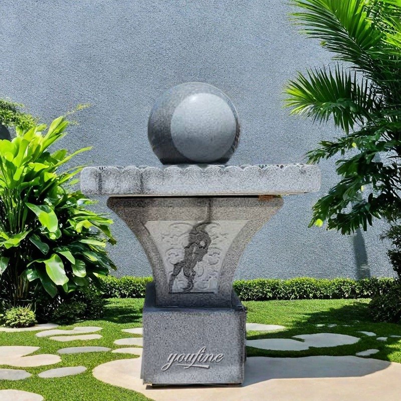 gray stone ball fountain