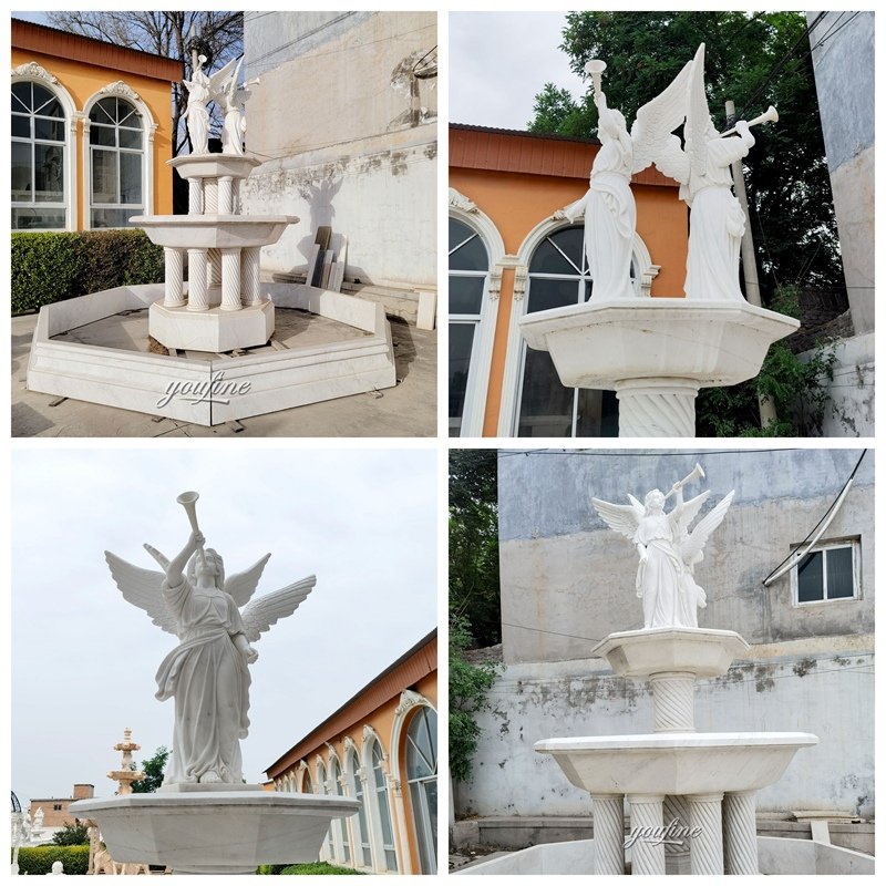 large marble angel fountain with trumpet details