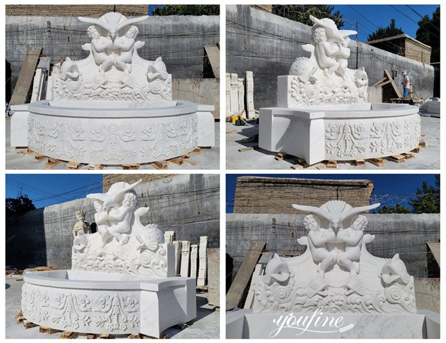 white carved marble eagle with cherub water fountain details