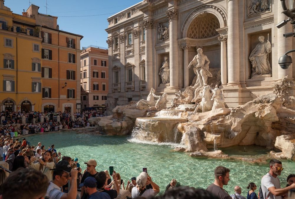 tourists visiting the trevi fountain