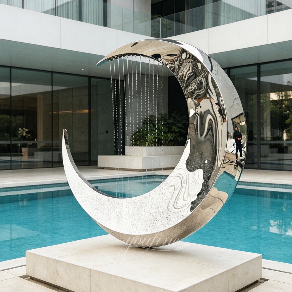 polished metal crescent moon sculpture fountain for pool decor
