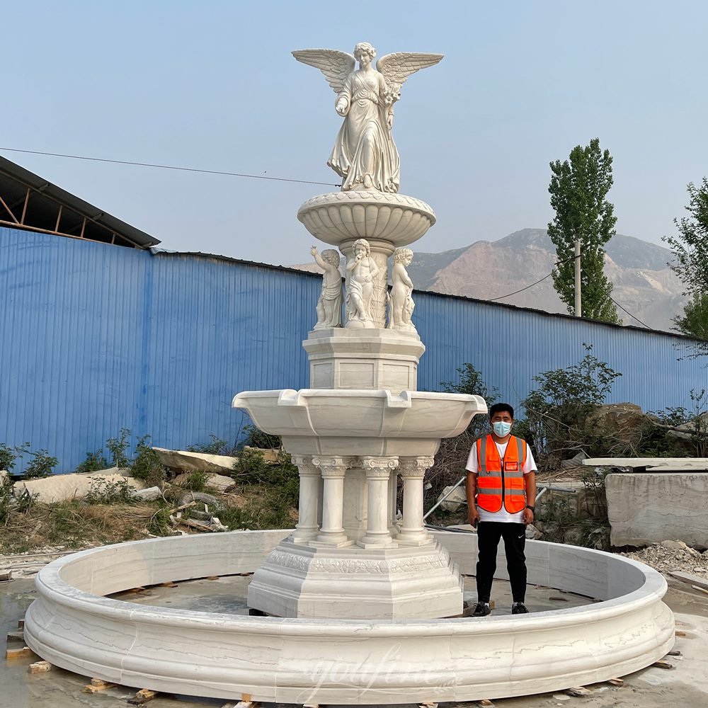 carved fountain with walking angel lily & cherub statues front view