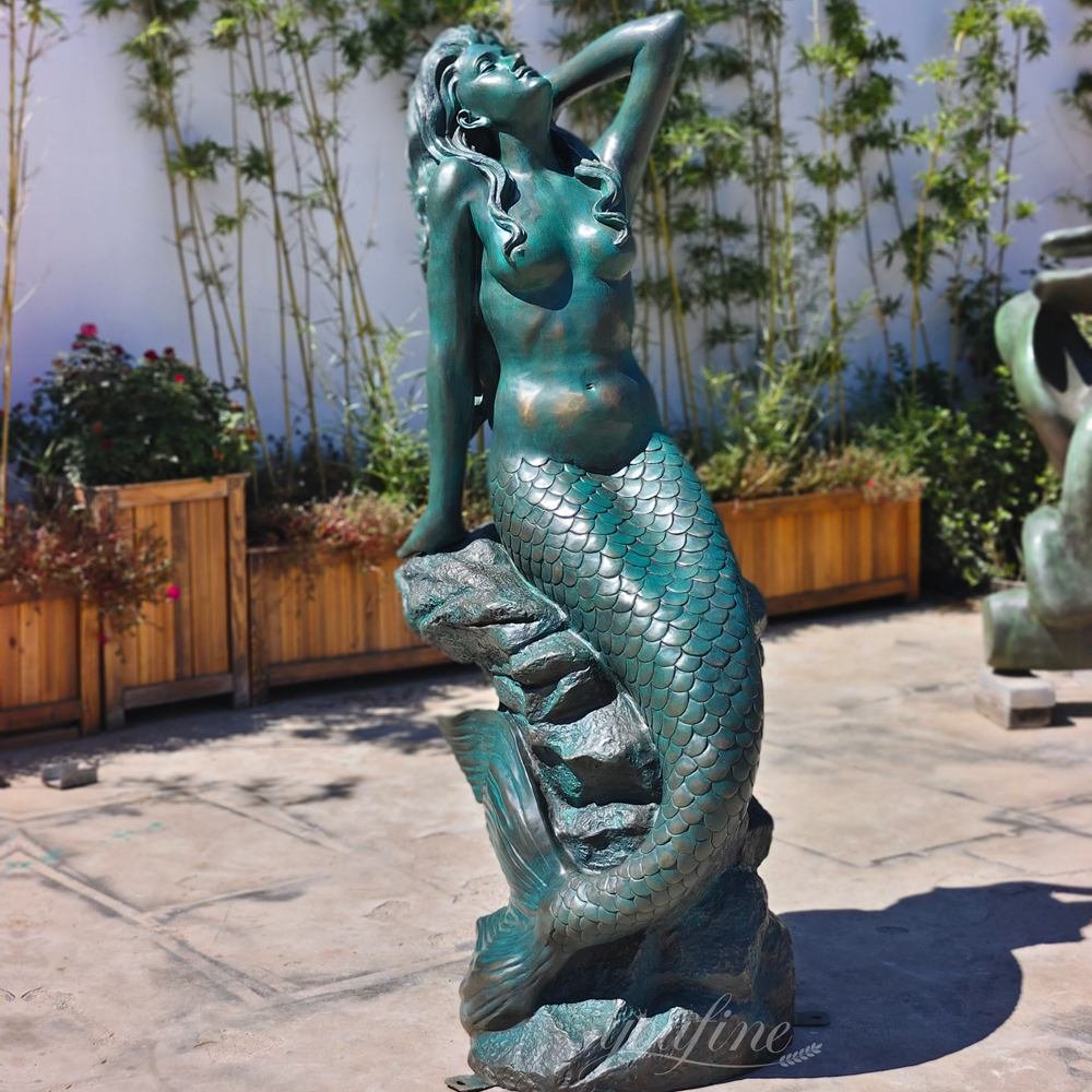 Finished sculpture seated on rock