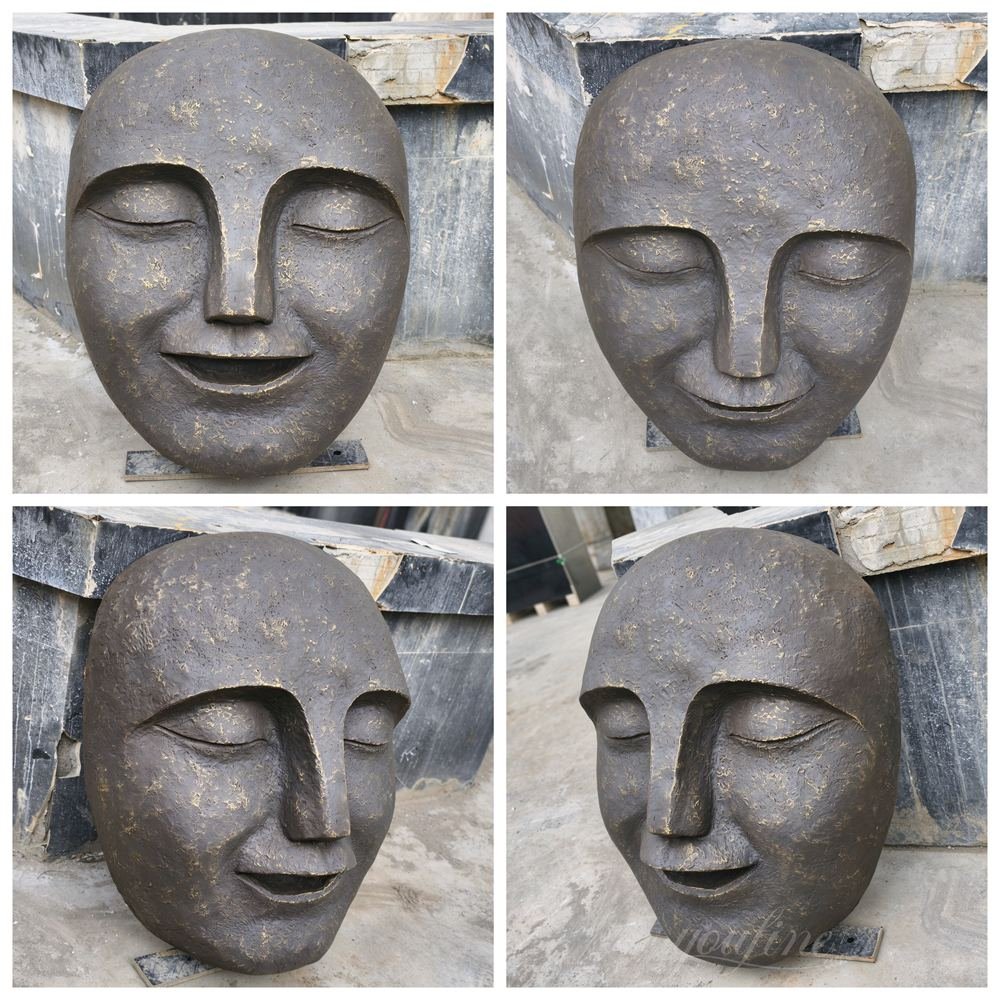 funny bronze face sculpture fountain details