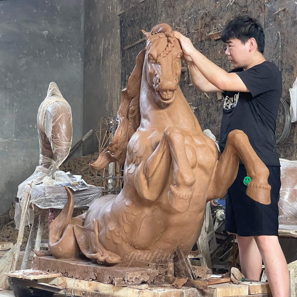 Making a clay model for a bronze fountain
