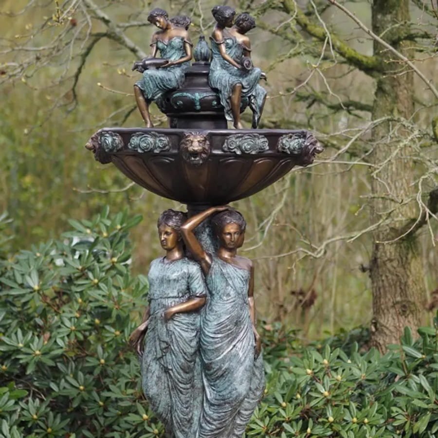 bronze tiered fountain with lady statues