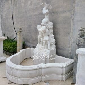 white marble fish wall fountain side view