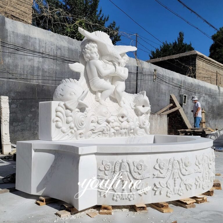 carved white marble eagle with cherub water fountain side view