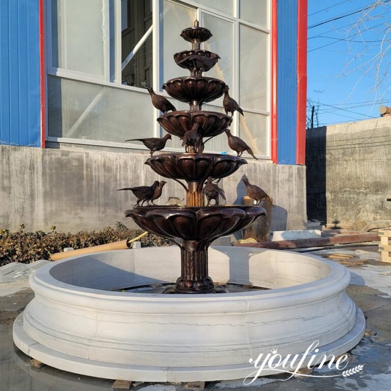 brown bronze bird bath fountain with marble pool