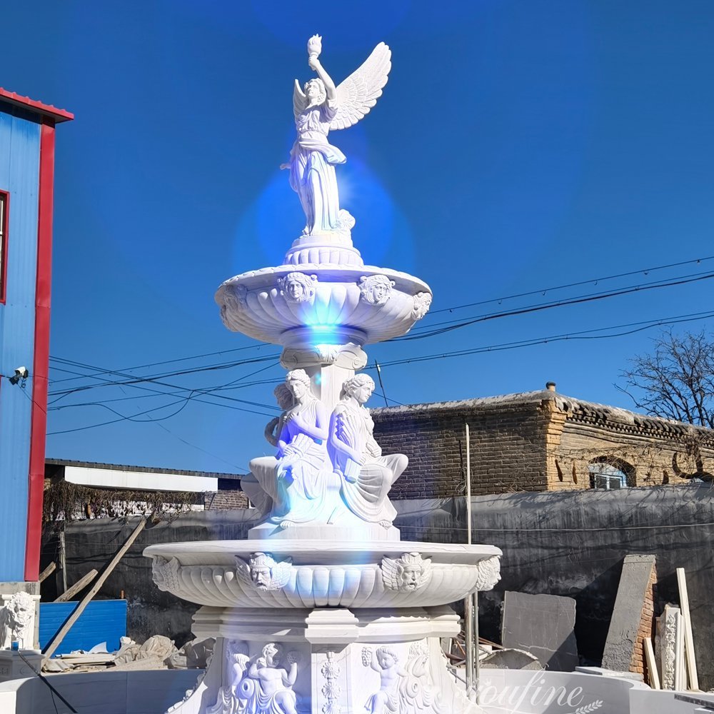 3 tiered fountain with an angel statue holding a torch top detail 3 tiered fountain with an angel statue holding a torch top detail