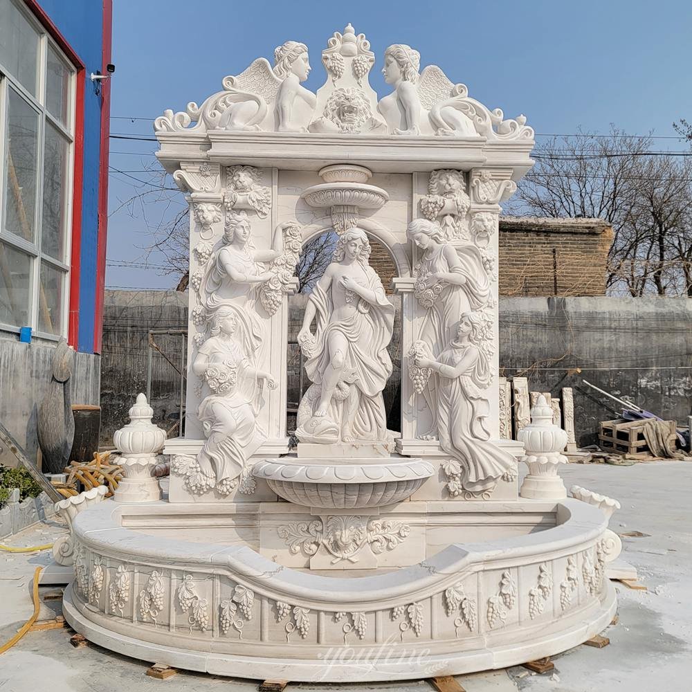 european marble goddess wall fountain with grape relief carvings front view european marble goddess wall fountain with grape relief carvings front view