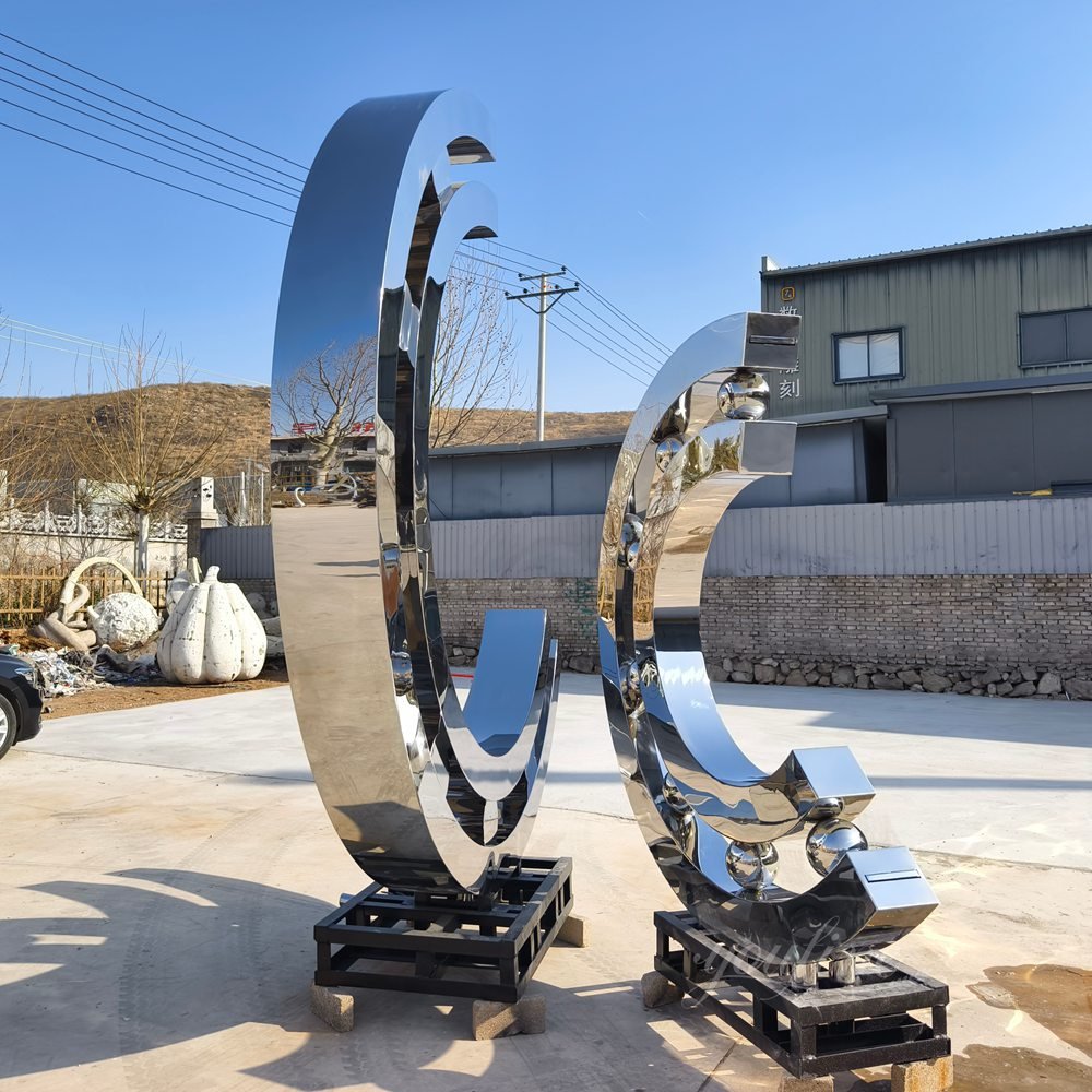 abstract metal bearing shaped mirror sculpture fountain back view abstract metal bearing shaped mirror sculpture fountain back view