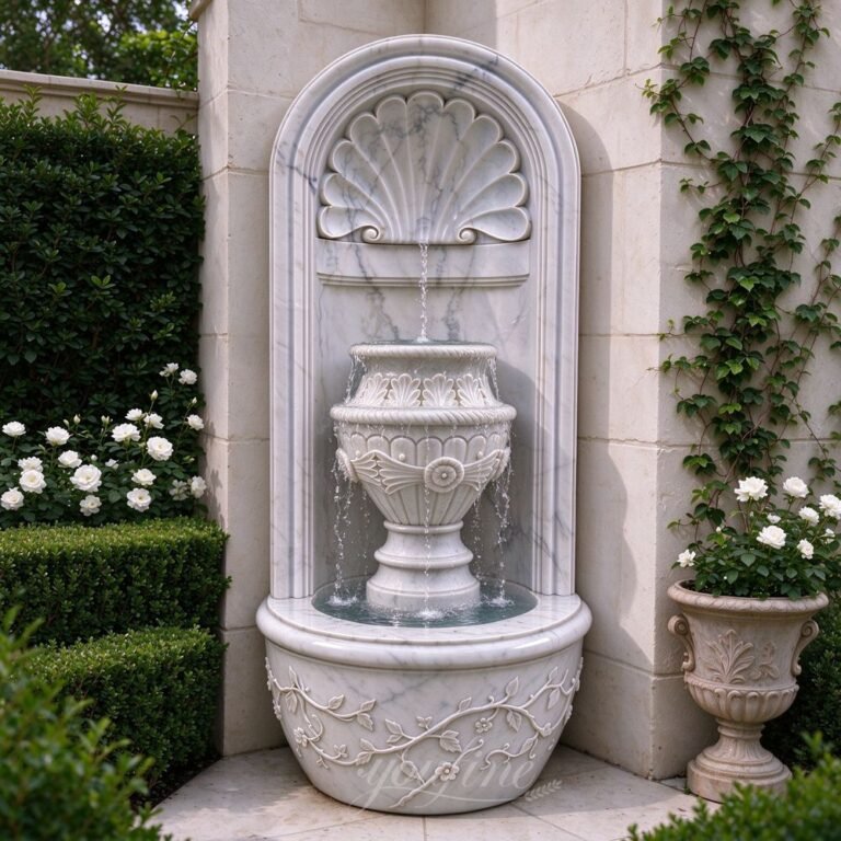 carved arch wall fountain with shell & urn carvings for yard