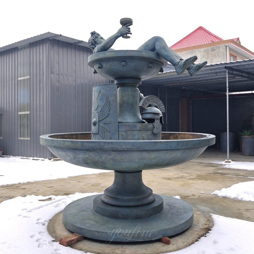 resting gladiator bronze patina two tier water fountain side view resting gladiator bronze patina two tier water fountain side view